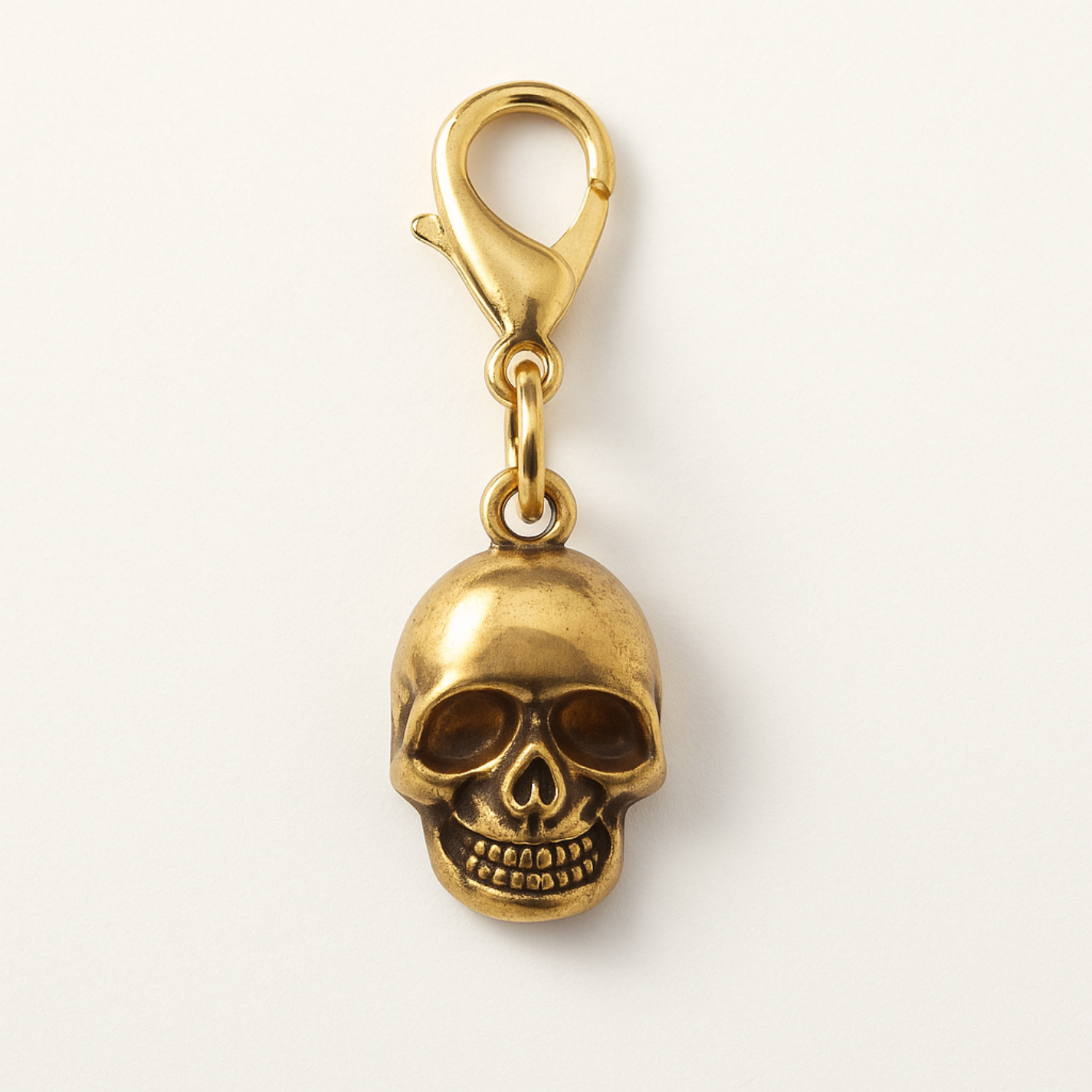 Gold Skull Kindle Charm